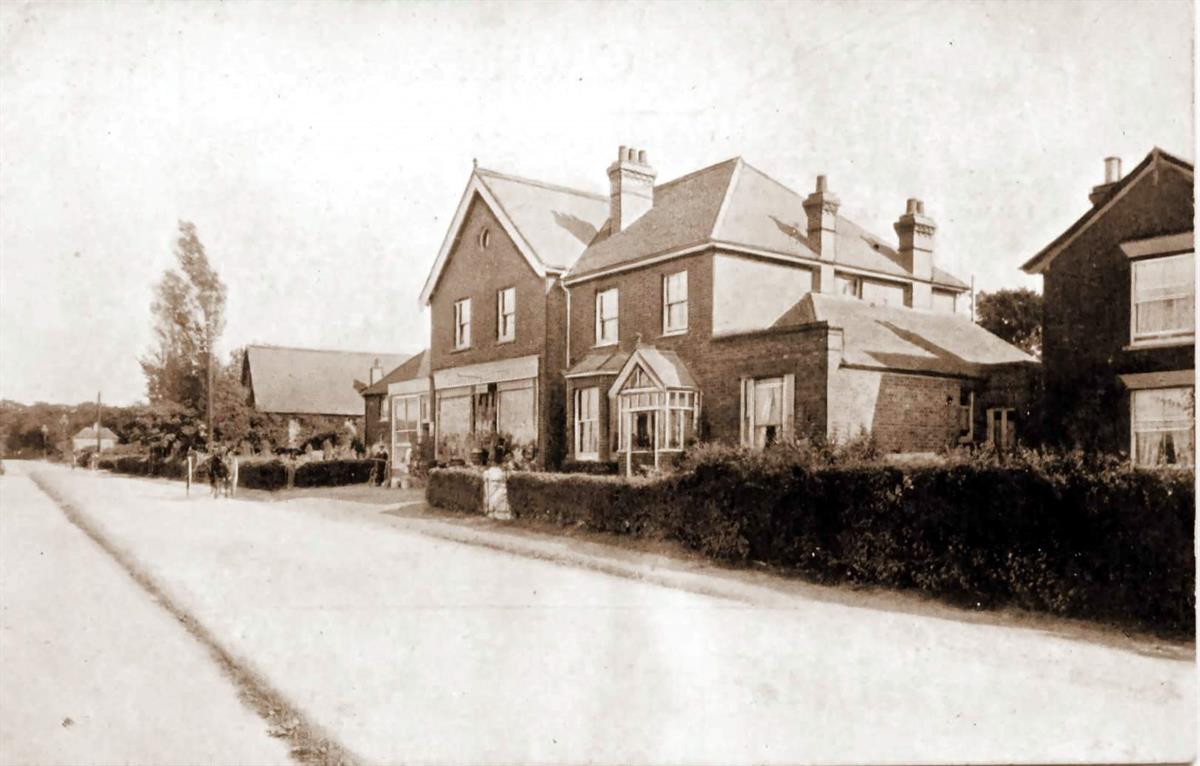 main road facing potten farm in the 1900's